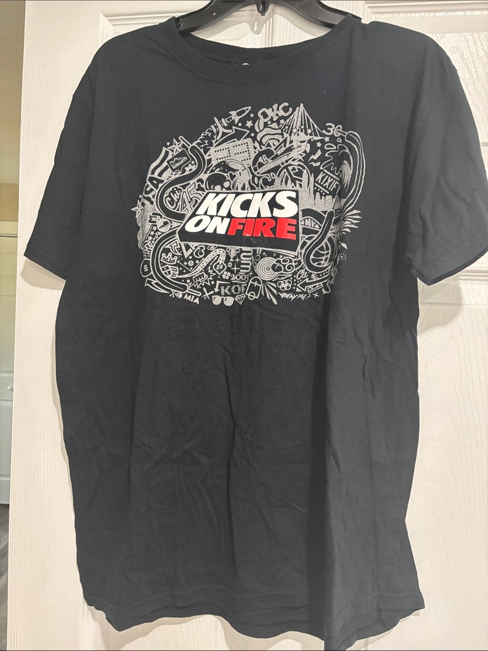 On Fire Black Graphic Tee with White and Red KICKS ON FIRE Logo